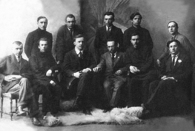 Image -- Hart members (1924). Sittinf (l-r): H. Kotsiuba, P. Tychyna, V. Blakytny, I. Kulyk, M. Khvylovy, V. Polishchuk. Standing (l-r): I. Dniprovsky, M. Yohansen, P. Panch, O. Kopylenko, V. Koriak.