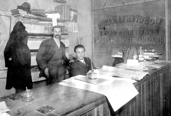 Image -- Myroslav Stechishin and matthew Popovich in the office of the Robochyi narod newspaper (Winnipeg).
