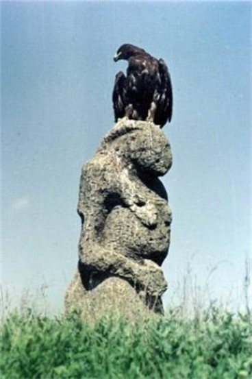 Image - A steppe eagle on a stone baba at the Askaniia Nova Nature Reserve.
