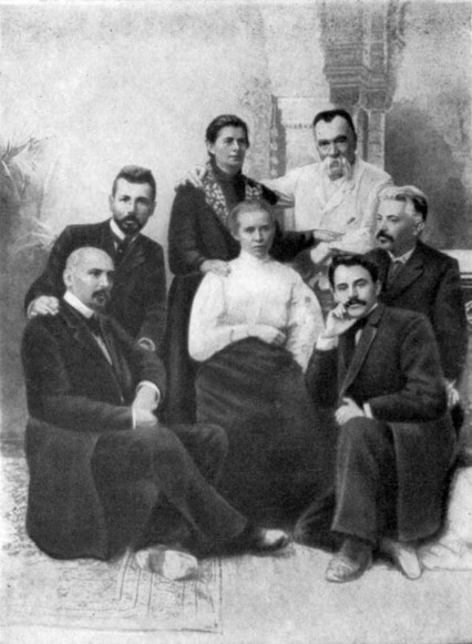Image -- A group of Ukrainian writers during the unveiling of Ivan Kotliarevsky monument in Poltava (1903). Sitting (left to right): M. Kotsiubynsky, V. Stefanyk, L. Ukrainka, H. Khotkevych, V. Samiilenko. Standing: O. Pchilka, M. Starytsky.