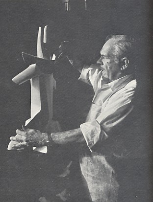 Image -- Alexander Archipenko working on his sculpture of King Solomon (1964)