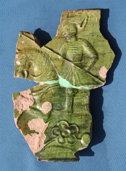 Image - Restored glazed ceramic stove tile with the relief of a mounted Cossack. The Archaeological Museum of the Baturyn National Historical Preserve. (Photo: A. Konopatsky, 2008).