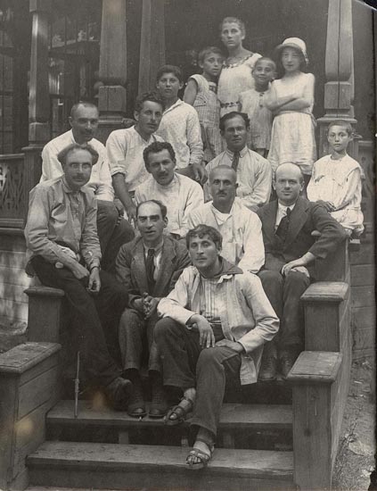 Image -- Der Nister amd Marc Chagal with children ant teachers (Moscow 1921).