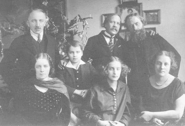 Image -- Mykola Vorony and Oleksa Novakivsky with Ivan Holubovsky and his family.