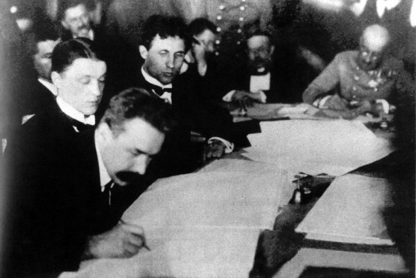 Image - Mykola H. Levytsky signing documents at the Brest-Litovsk Peace negotiations (1918).