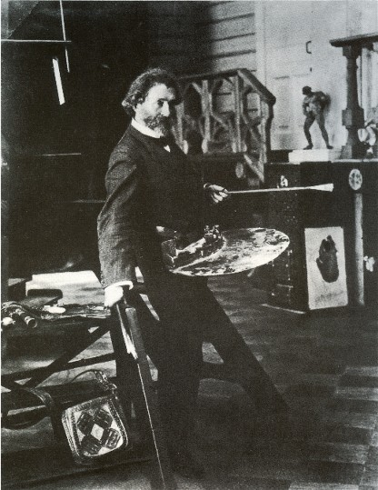Image -- Ilia Repin in his studio (1906 photo).