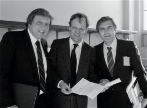 Image -- Roy Romanow (right) at the signing of teh so-called Kitchen Accord (1981).