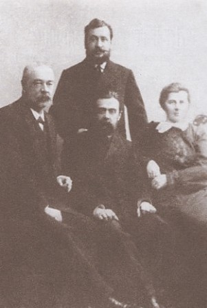 Image -- I. Shrah, V. Naumenko, O. Pchilka, and M. Dmytriev (standing) in the Ukrainian delegation sent to Saint Petersburg to obtain permission for publishing Ukrainian periodicals (1906).