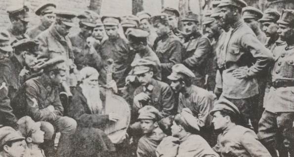 Image -- Sich Riflemen listening to a kobzar in Kyiv.