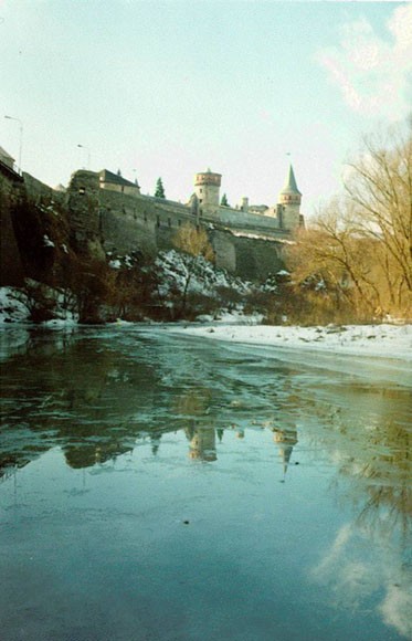 Image - The Smotrych River flowing past the Kamianets-Podilskyi castle.