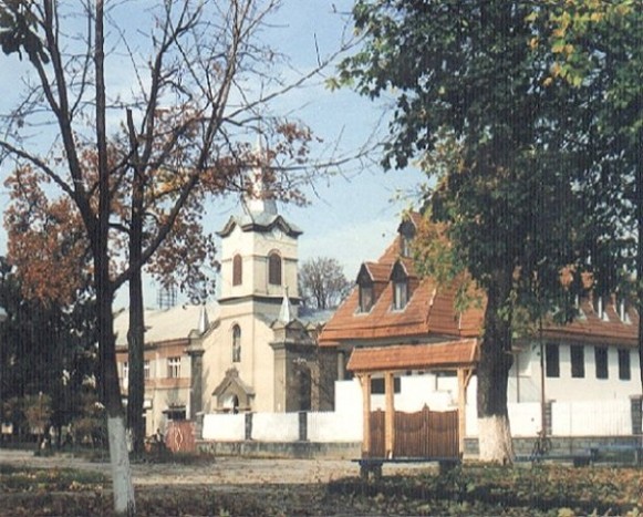 Image - Tiachiv: The Protestant Church (13th century, rebuilt in 18th century) and the parish building.