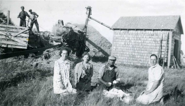 Image -- Ukrainian farmers near Foam Lake, Saskatchewan (photo, courtesy of the Ukrainian Museum of Canada, Saskatoon Branch).