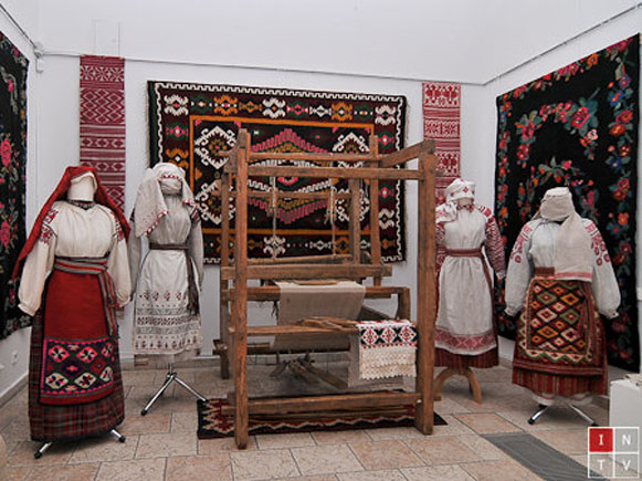 Image - A traditional weaver's loom and folk dresses from Podilia.